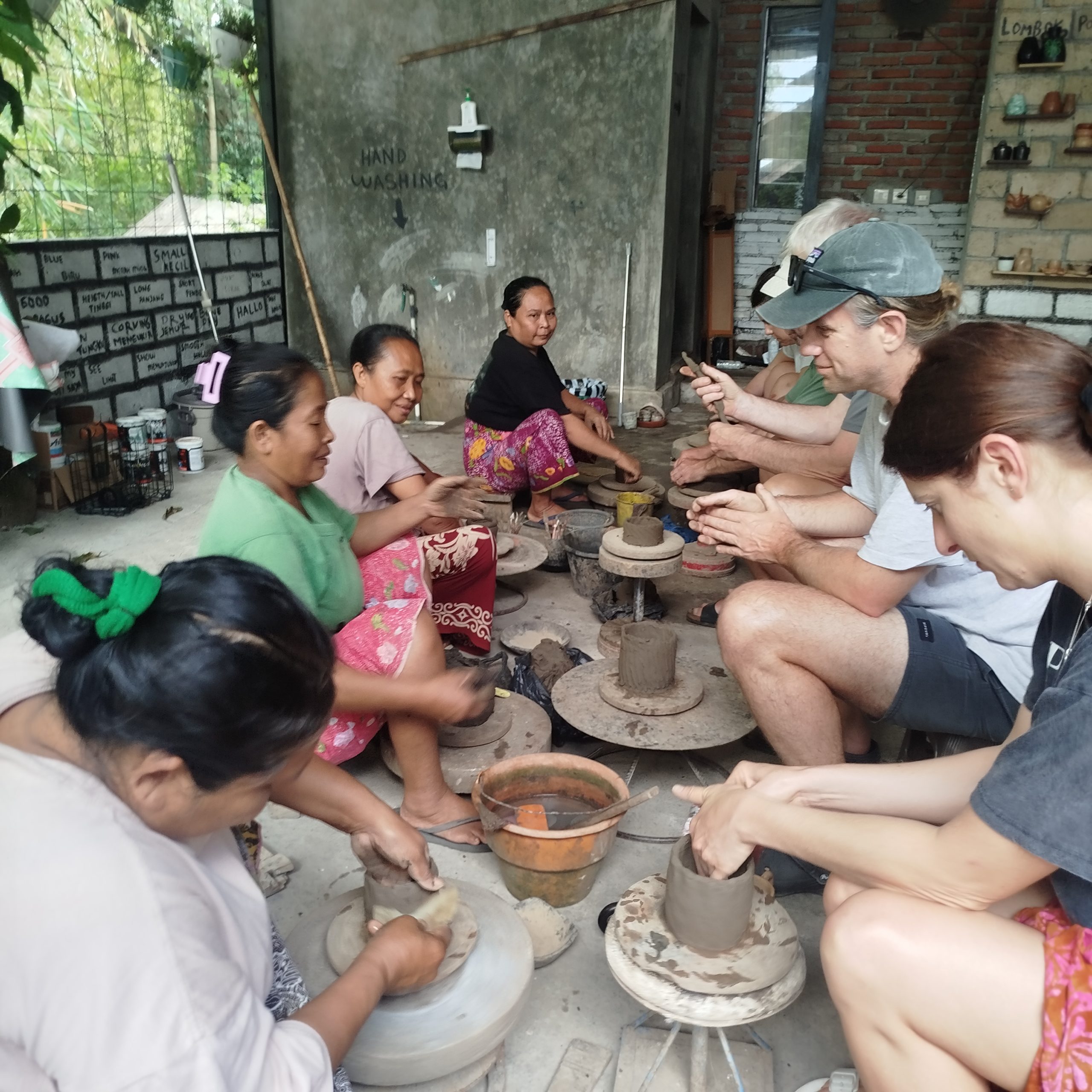 Traveler joining pottery and cooking workshops in Lombok surrounded by local artisans and village scenery