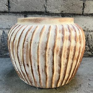 Handcrafted Ripple Pot made from terracotta with textured ripple design and rustic natural finish.